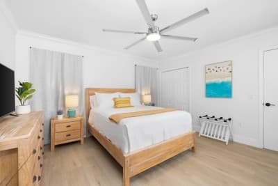 Bedroom 2 offers a cozy retreat with a comfortable queen-sized bed—ideal for guests or family, complete with relaxing touches.