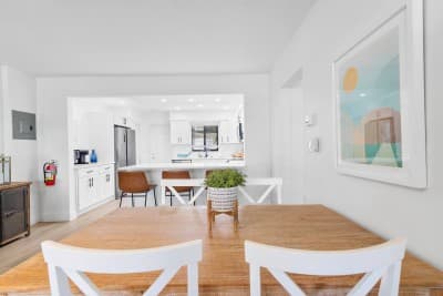 Enjoy meals just steps from the kitchen in this inviting dining space—perfect for morning coffee or a cozy dinner at home.